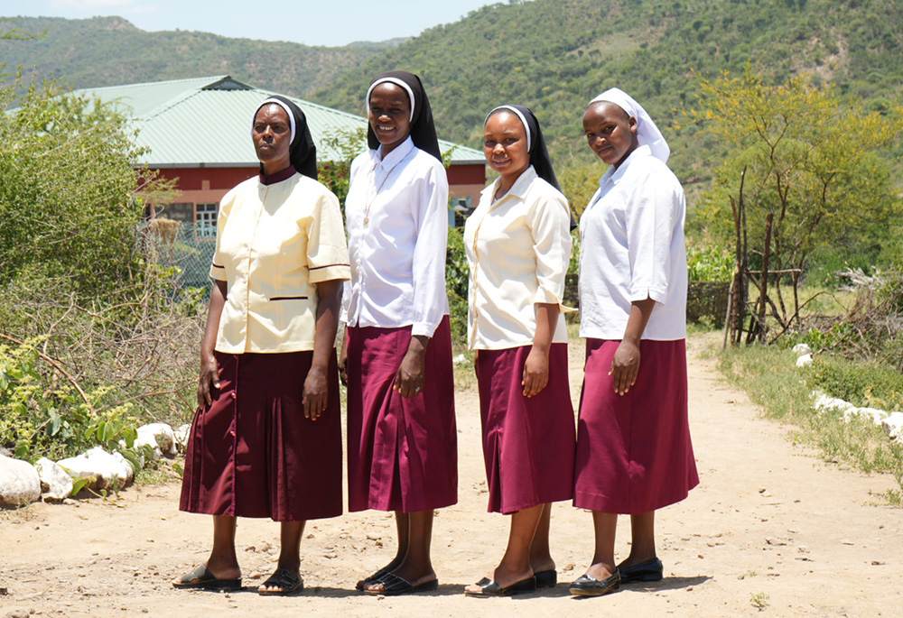 From left: Incarnate Word Srs. Jannifer Hiuhu, Phelomena Nyambu, Annestacia Wanza, and Aquilina Munyao in front of their convent in Rotu, a semiarid village in East Pokot, Baringo County. Hiuhu is the community superior, Nyambu is the acting head teacher of the Rotu Primary School, Wanza is in charge of the Association of Volunteers in International Service nonprofit's East Pokot program, and Munyao is a novice sister and teacher at the Rotu Primary School. (GSR photo/Wycliff Peter Oundo)