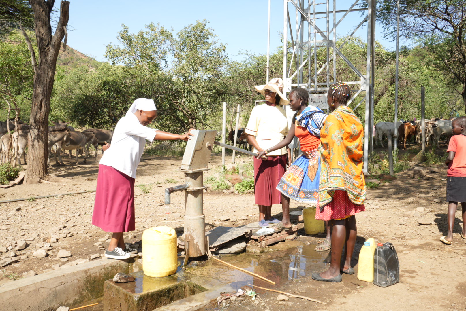 Srs. Aquilina Munyao and Jannifer Hiuhu inspect a borehole that the church drilled for the Rotu village. The community protects and maintains the borehole, the only water source for families and their flocks. The congregation is advocating for more water sources, which would allow the nomadic Pokot people to settle in villages and inspire urbanization in these rural communities. (GSR photo/Wycliff Peter Oundo)