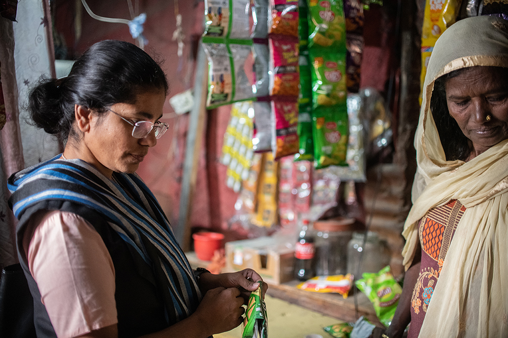 Sr. Rani Punnaserril, a member of the Sisters of the Holy Cross Menzingen, visits Sabila Khatoon’s shop, which sells mainly chips, biscuits and snacks for children, The shop is now a source of a steady income for her. (Photo courtesy of Mubeen Siddiqui/ICMC)