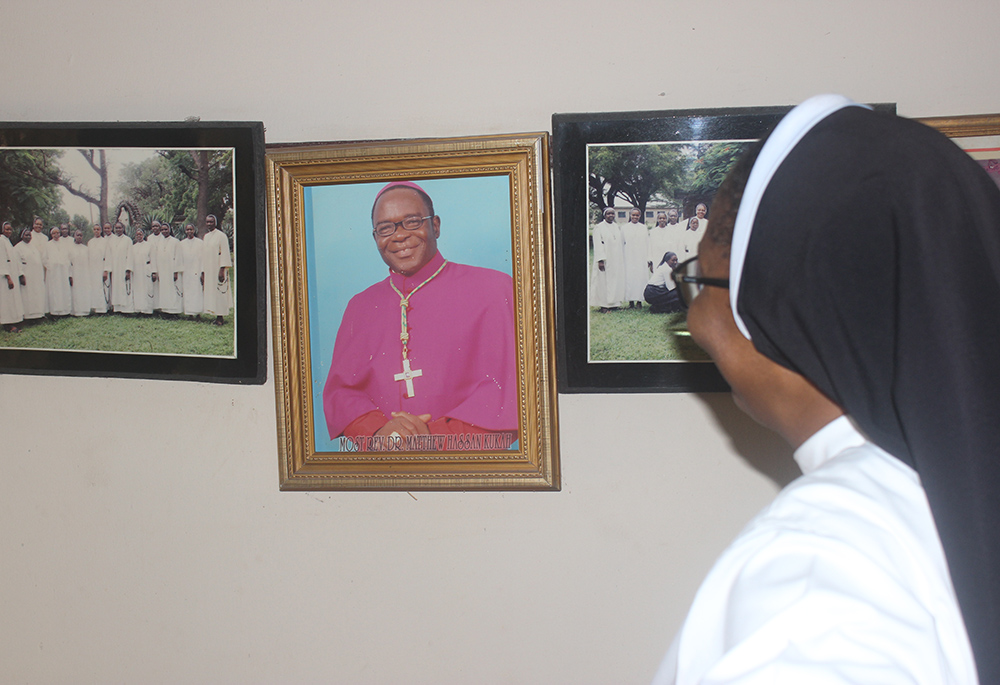 Sr. Justina Nnajiofor and other sisters in the community always pray inside their compound for God's protection. Nnajiofor is pictured inside, near a picture of Bishop Matthew Hassan Kukah of Sokoto, Nigeria. (Patrick Egwu)