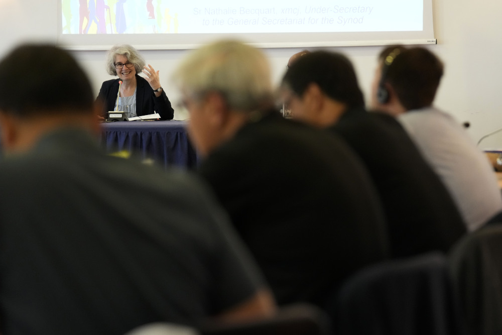 Sr. Nathalie Becquart, right, the first female undersecretary in the Vatican's Synod of Bishops, gives a lesson to a religious male congregation in Sacrofano, near Rome June 5. (AP/Alessandra Tarantino)