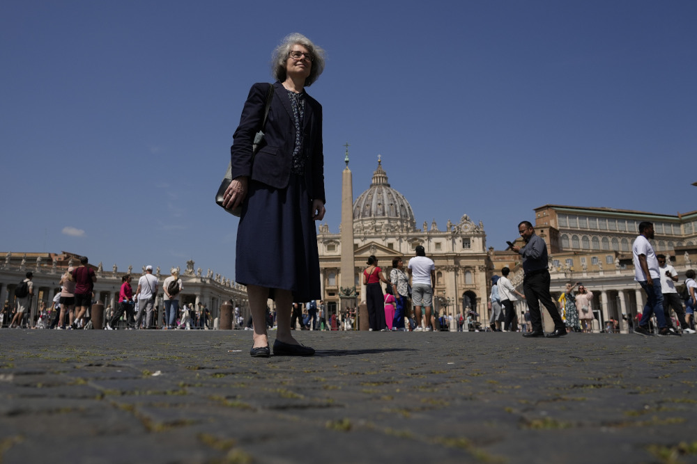 Sr. Nathalie Becquart, the first female undersecretary in the Vatican's Synod of Bishops, poses for a photo in front of St. Peter's Square May 29. Becquart is charting the global church through an unprecedented, and even stormy, period of reform as one of the highest-ranking women at the Vatican. (AP/Alessandra Tarantino)