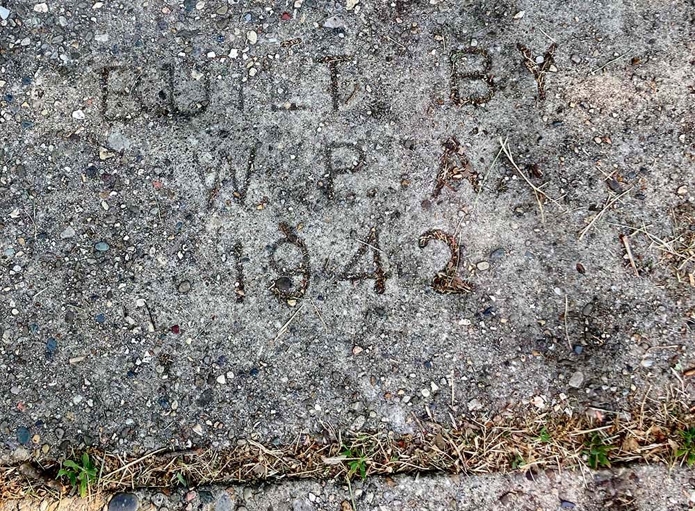 A stamp on the sidewalk near Sr. Emily TeKolste's neighborhood in Terre Haute, Indiana, reads "Built by W.P.A. 1942." (Courtesy of Emily TeKolste)