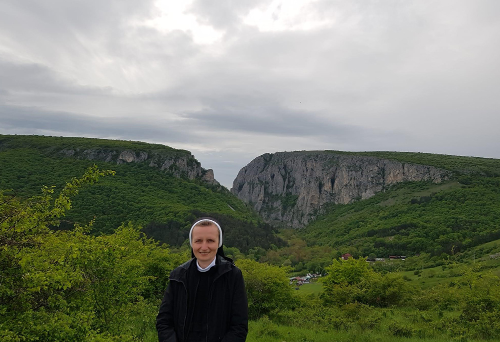 Sr. Teodozija Myroslava Mostepaniuk is pictured in a photo taken in May at Cheile Turzii ("The Keys of Turda") canyon in Romania. (Courtesy of the Sisters of the Order of St. Basil the Great)