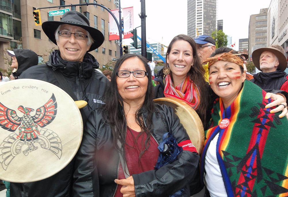 Sr. Norma McDonald, left, participates in a walk during the Truth and Reconciliation Committee in Vancouver 2013 with Nora Martin (Tla-o-qui-aht First Nation), Janelle Delorme (a réconciliACTION participant 2013) and Margaret Eaton (Tla-o-qui-aht First Nation). (Courtesy of Sr. Norma McDonald)