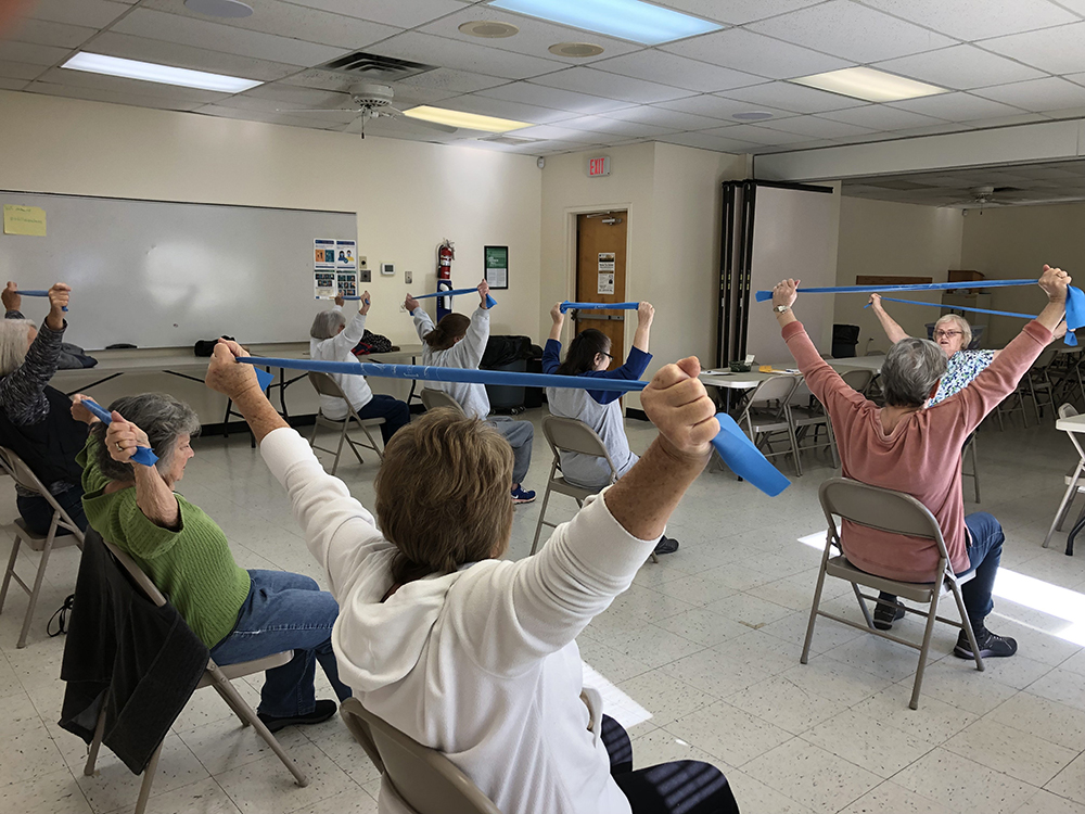 Sr. Loretta Spotila, a member of the Sisters of Charity of St. Augustine, who is the founder of the Interfaith Wellness Ministry in Estill County, Kentucky, back right, is pictured in an undated photo leading a fitness class. (OSV News/Courtresy of Sr. Loretta Spotila)