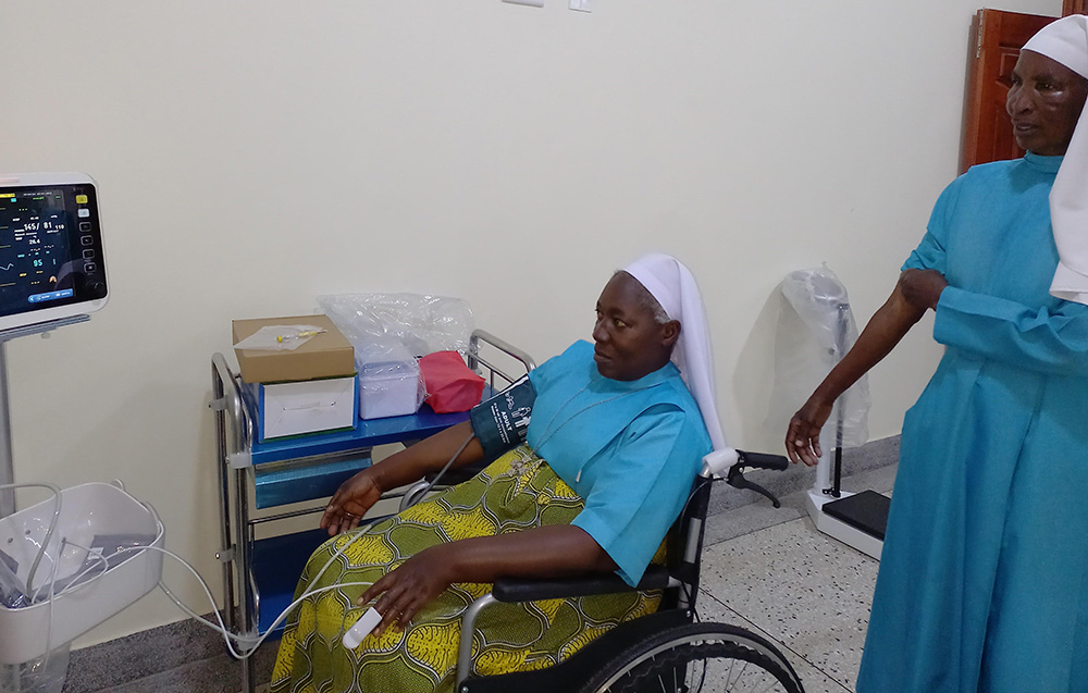 Good Samaritan Sisters Rose, left, and Batulumawo are examined at St. Veronica Medical Centre in Ttomi Buloba, Uganda. (Courtesy of the Sisters of the Good Samaritan)