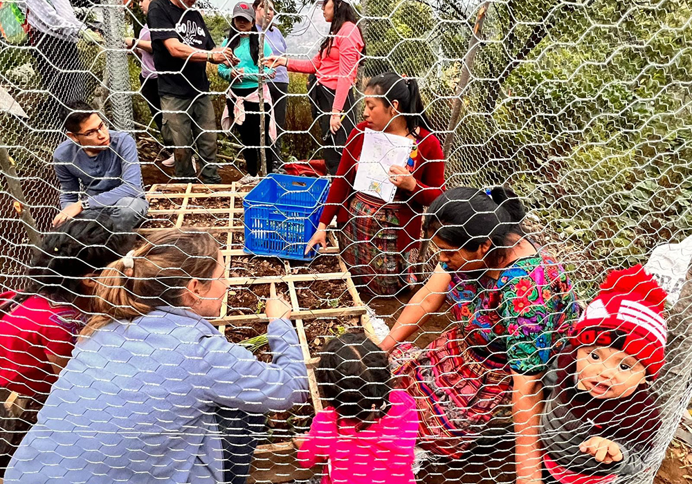 The University of the Incarnate Word group helped to build eight garden plots for different families during a service trip to Guatemala. (Courtesy of Martha Ann Kirk)