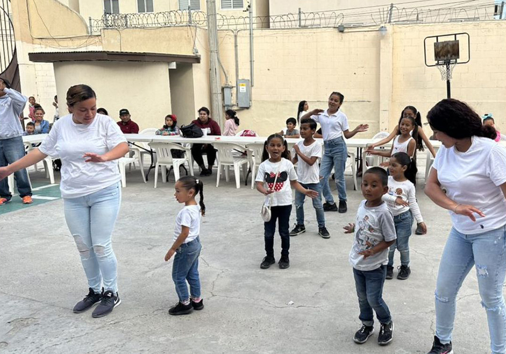 Kids dance during a fun activity at Casa Eudes in Tijuana, Mexico. (Courtesy of Caroline Price)
