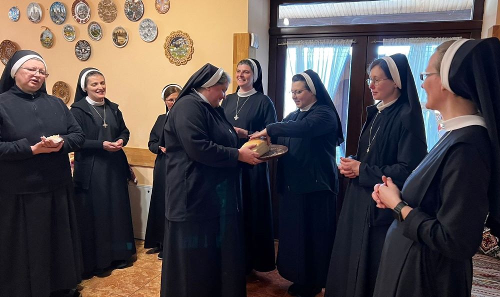 Basilian Sisters in Ukraine share bread they baked together. The author compares intercultural life in women's religious communities to the process of baking bread as ingredients come together in their diversity. (Courtesy of Yeremiya Steblyna)