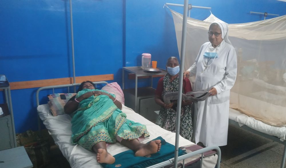 Sr. Sandra Joseph, a nurse who works with couples who have had trouble conceiving, visits a pregnant woman at St. Vincent Hospital in Dinajpur, Bangladesh. (Sumon Corraya)