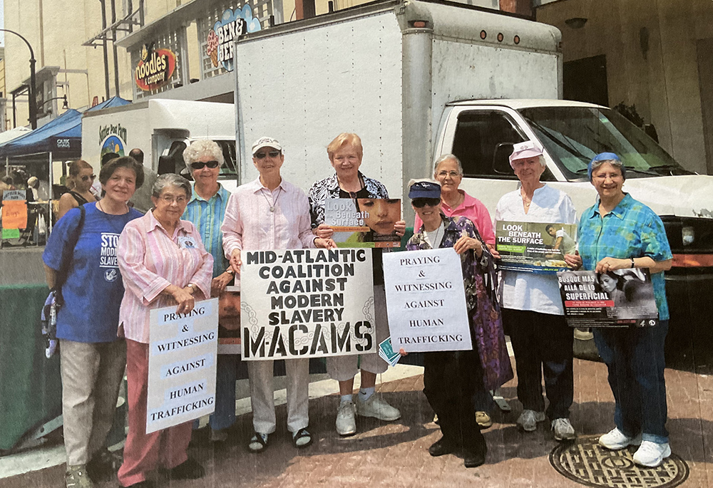 Members of the Mid-Atlantic Coalition Against Modern Slavery demonstrate in Silver Spring, Maryland. Pictured from left are Srs. Carroll Ann Kemp, Frankie Barber, Ann Marean, and Kathleen Keller of the Sisters of the Holy Names of Jesus and Mary; Kate Finan; Sr. Marie Romecko of the Sisters of Notre Dame de Namur; Sr. Marie Pilar Chamorro of the Carmelite Sisters of Charity; Sr. Carol Ries of the Sisters of the Holy Names of Jesus and Mary; and Sr. Carmen Soto of the Carmelite Sisters of Charity.