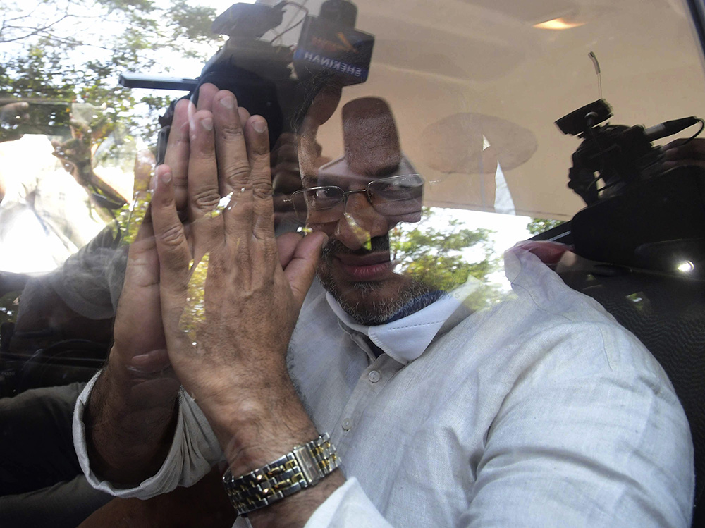 Bishop Franco Mulakkal greets the media as he leaves a court in Kottayam, India, Jan. 14, 2022, after his acquittal of raping a nun. Mulakkal resigned as leader of the Jalandhar Diocese in the northern state of Punjab on June 1, 2023. (AP Photo/File)