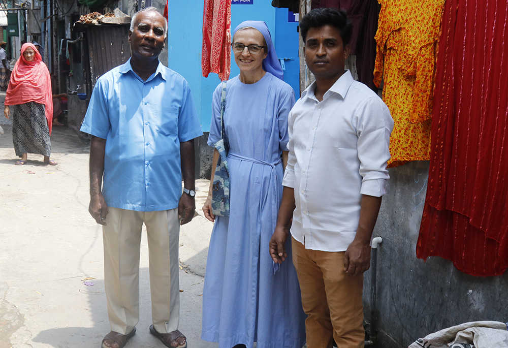 From left: Amrito Martin Halder, Sr. Ombretta Neri and Ranojeet Baroi pose for a photo. Baroi, 28, has been teaching in this school for almost two years. He is a former student of the St. Mary's Infant School. (Stephan Uttom Rozario)