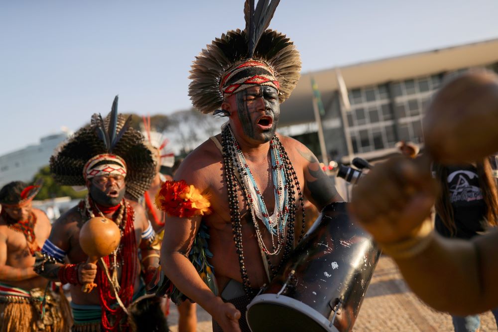 Indigenous people take part in a protest in Brasilia Aug. 25, 2021, the first day of Brazil's supreme court trial of a case on Indigenous land rights. (CNS/Reuters/Adriano Machado)