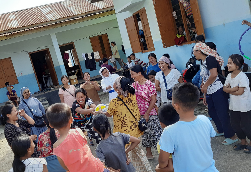 Members of the Medical Sisters of St. Joseph and Salesian Missionaries of Mary Immaculate organize play therapy for the children in the relief camp at Kankopi district of Manipur. The state government reported July 10 that nearly 54,500 people had been displaced by ongoing violence, most of whom were living in relief camps. (Courtesy of Sr. Sumam Kalathil)