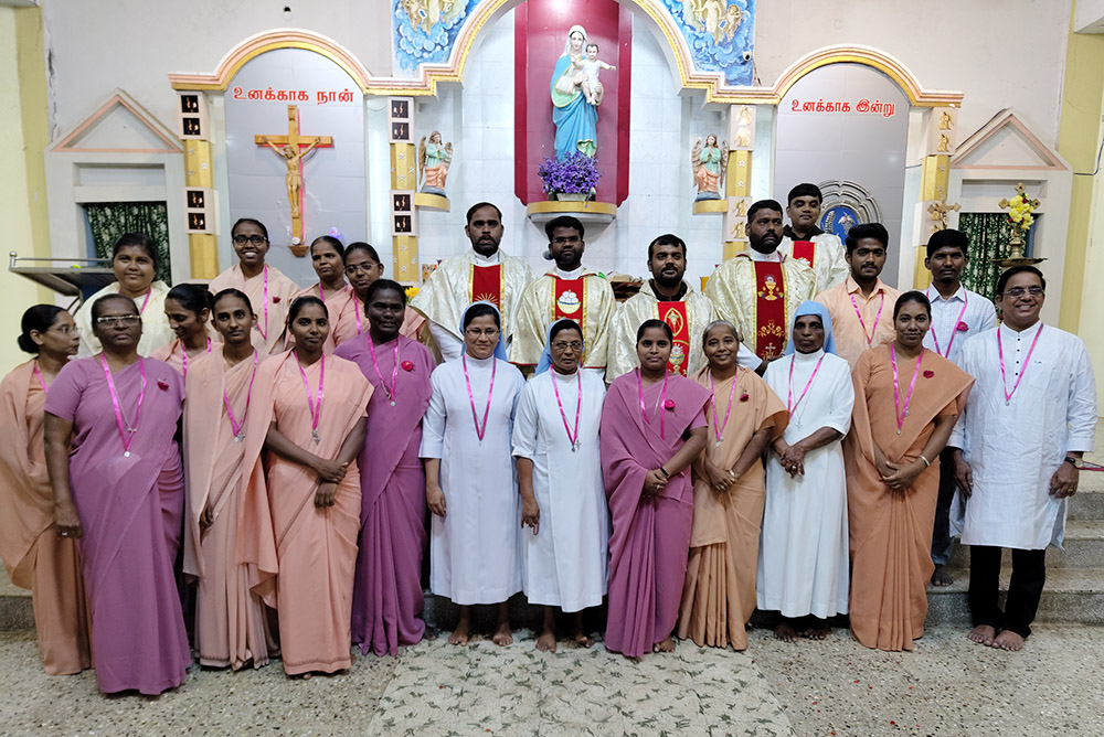 Religious communities gather for Mass on the Day of Consecrated Life at Our Lady the Healer Church in Karumandapam, Tiruchirappalli, Tamil Nadu, south India. The words written on the wall above the crucifix translate to "I am for you." (Courtesy of Robancy Helen)