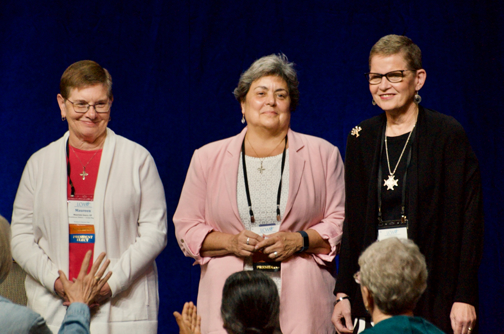 Leadership Conference of Women Religious president Sr. Maureen Geary, past president Sr. Rebecca Ann Gemma and president-elect Sr. Sue Ernster are blessed Aug. 11, after taking office at annual assembly in Dallas. (GSR photo/Dan Stockman)