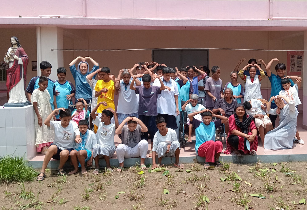 Members of Kkottongnae Sisters of Jesus in Bangladesh, their staff members and orphans are pictured at Kuchilabari in Gazipur, near Dhaka. (Sumon Corraya)