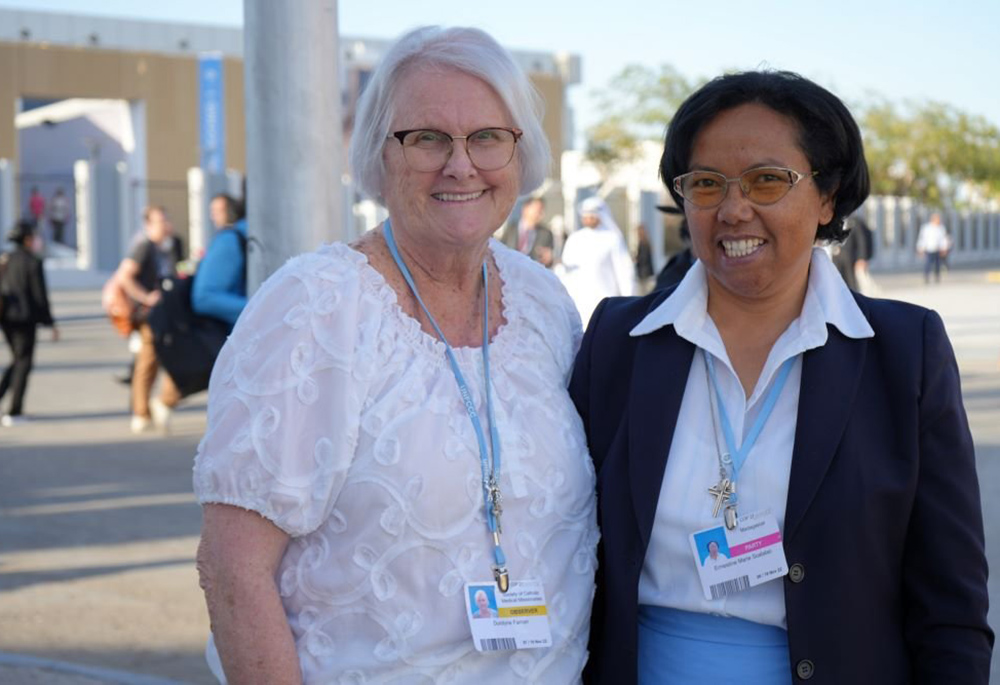Adrian Dominican Sr. Durstyne Farnan, left, from Michigan, poses with Sr. Ernestine Lalao, a member of Our Lady of Charity of the Good Shepherd from Madagascar at the 2022 U.N. climate change conference in Sharm el-Sheikh, Egypt. (CNS/EarthBeat/Doreen Ajiambo)