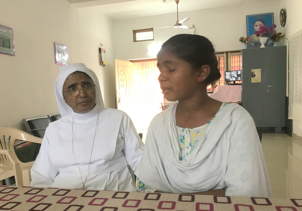Kavitha, a village young woman who studies at the Sree Jeevan Jyothi Vocational Junior College, talks about her early marriage and separation as Sr. Ignatius Suman, the director, consoles her. (GSR photo/Thomas Scaria)