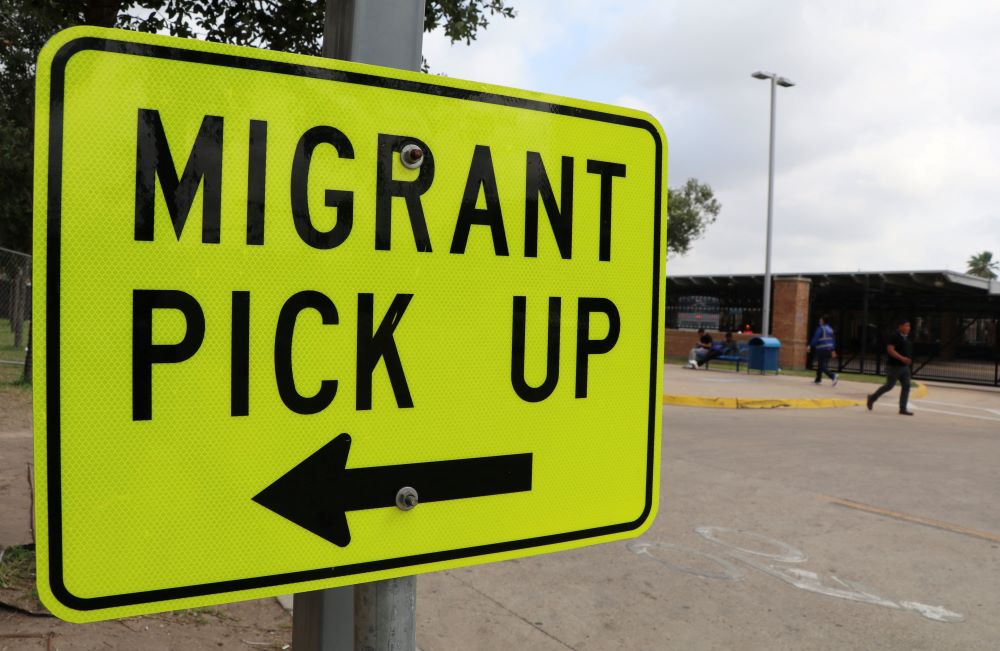 A sign indicates where migrants can be picked up at La Plaza bus station in Brownsville, Texas, May 11. (OSV News/Reuters/Evan Garcia)