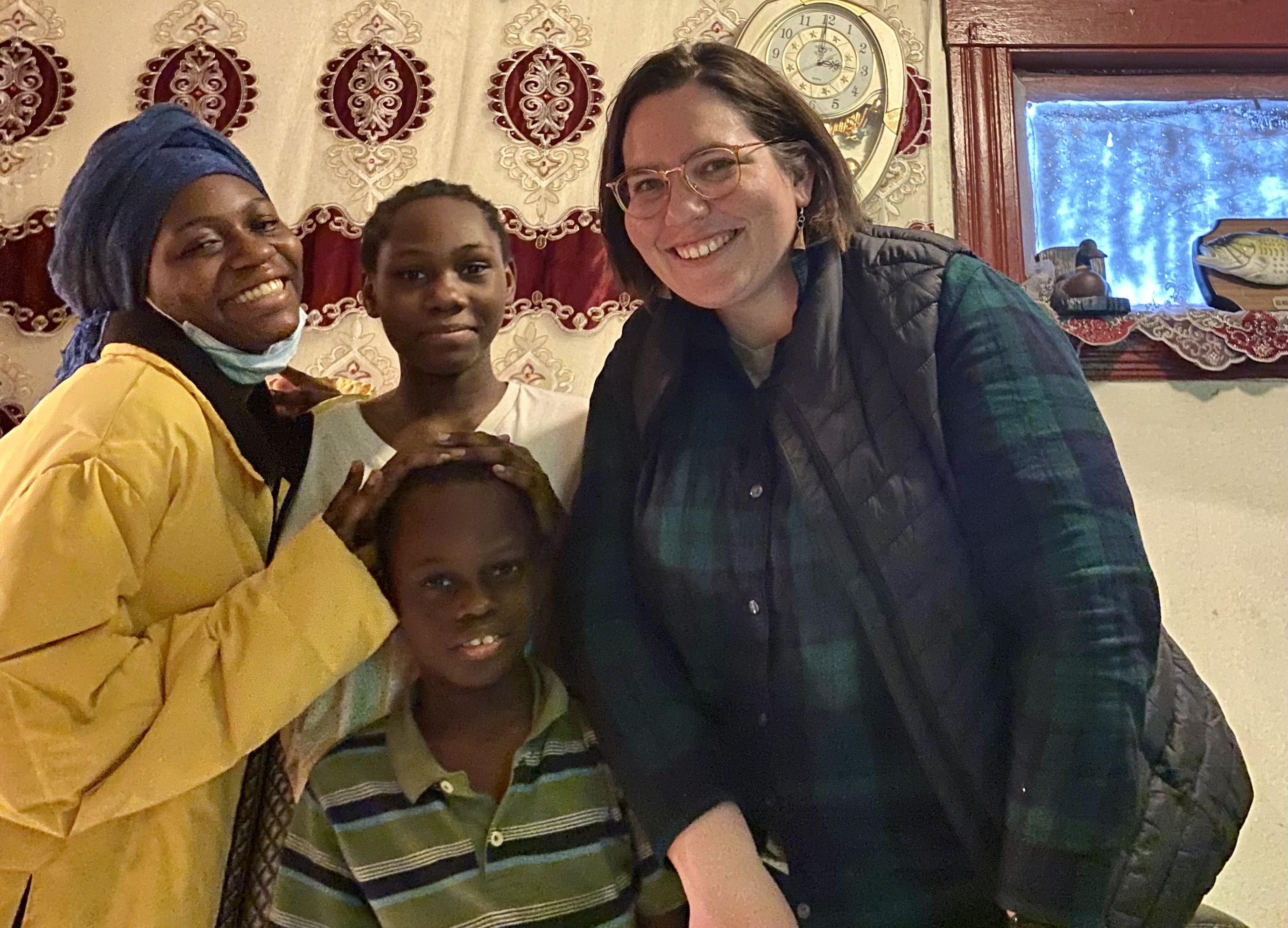 Sr. Ellis McCulloh celebrates Christmas with a Congolese family she worked with as a case manager for several years as part of her ministry.