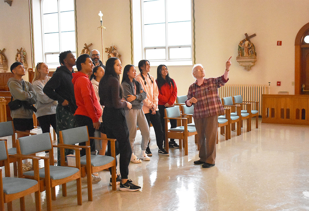 Benedictine Sr. Lillian Englert gives the Benedictine Scholars from St. Martin's University in Lacey, Washington, a tour of the chapel during their recent stay at the Center for Benedictine Life at the Monastery of St. Gertrude in Cottonwood, Idaho. (Julie A. Ferraro)