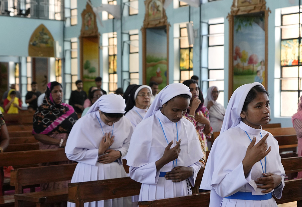 Catholic nuns attend a Mass at a church on Easter Sunday in Jammu, India, April 9. (AP/Channi Anand)