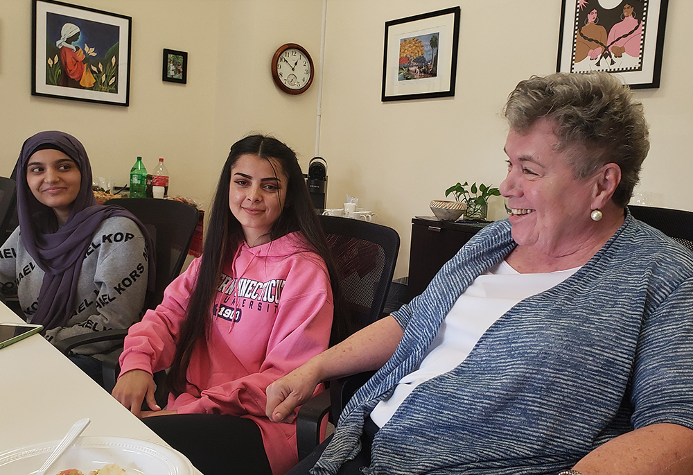 From left to right, refugees Tamana Sayed and Saliha Shams, both from Afghanistan, and Sr. Annelle Fitzpatrick, director of the refugee resettlement program on the campus of the Sisters of St. Joseph of Brentwood, New York. (GSR photo/Chris Herlinger)