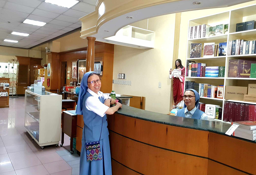 Pauline Sr. Pinky Barrientos (standing) and Sr. Christine Sundin inside the Pauline bookshop. The bookshop is located at the ground floor of the provincial house and communication center building. (GSR photo/Oliver Samson)