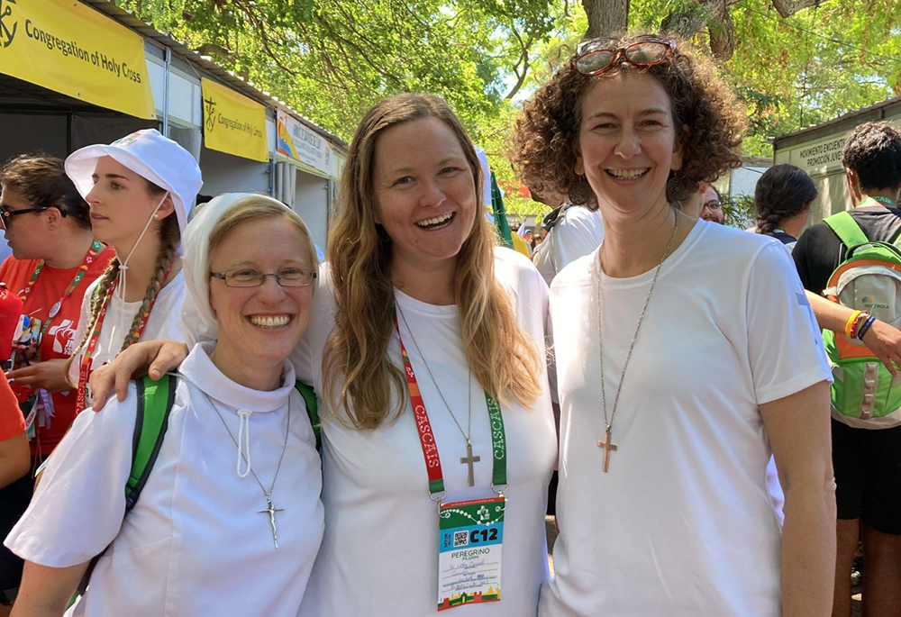 Sisters who connected via the organization Giving Voice meet in person for the first time at the City of Joy during World Youth Day in Lisbon, Portugal. From left are Apostle of the Sacred Heart Sr. Kathryn Press, and Sr. Libby Osgood and Sr. Christa Gesztesi of the Congregation of Notre Dame de Montreal. (Courtesy of Libby Osgood)