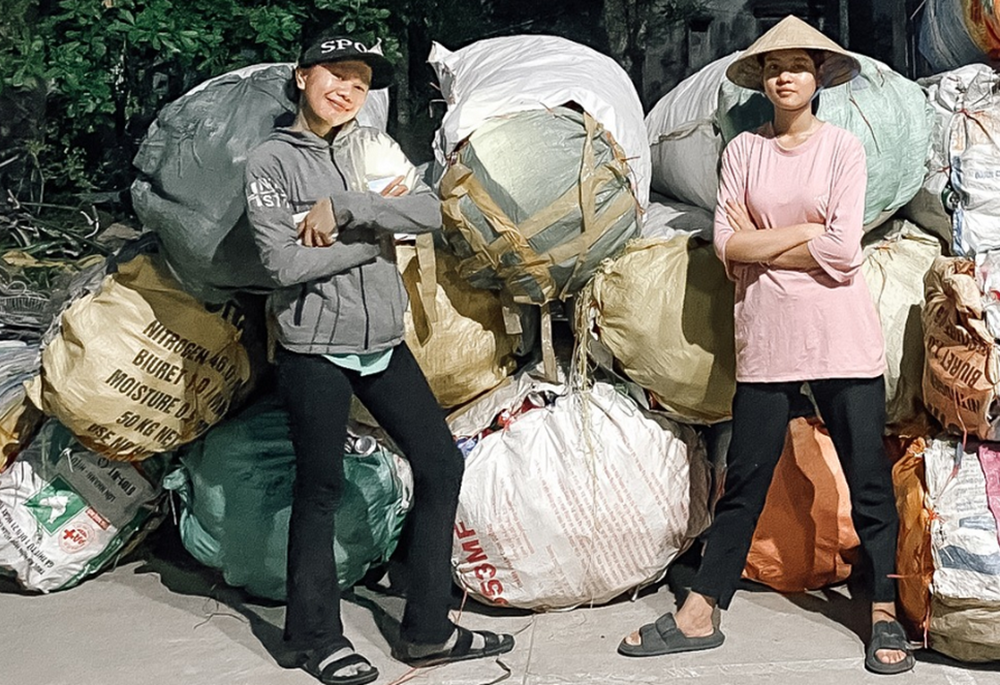 Servants of the Gospel Sr. Anna Le Thi Phap (left) and a lay volunteer from Phu Xuan parish's Catholic Youths Association collect and sell paper, metal, and plastic scrap from local households three days a week, with proceeds going to people in need. (GSR photo/Joachim Pham)