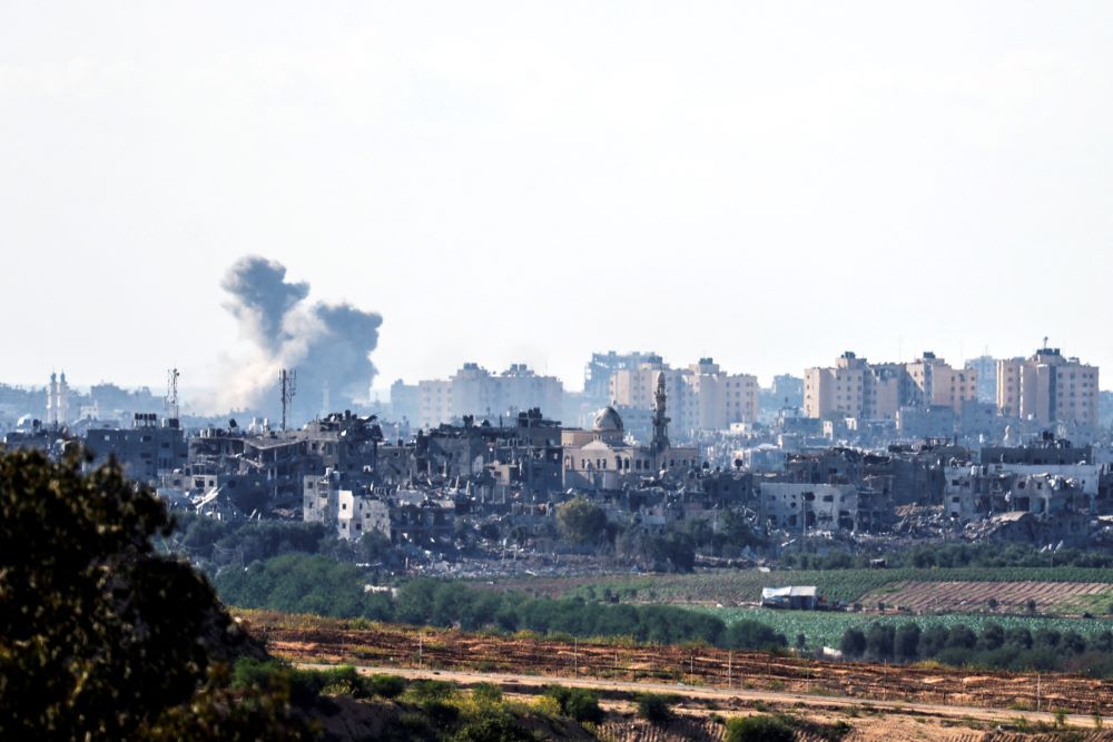 Smoke rises amid destroyed buildings in the Gaza Strip as seen from Israel's border with the Gaza Strip in southern Israel Oct. 18.
