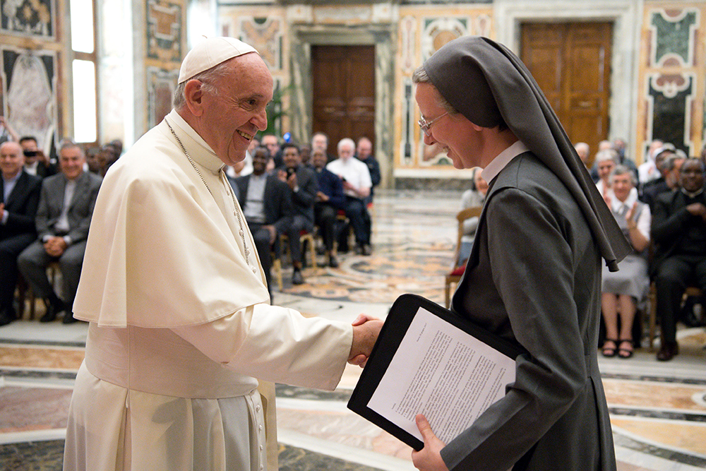 Pope Francis greets Consolata Sr. Simona Brambilla, superior general of the Consolata Missionary Sisters, during a June 5, 2017, audience with the men's and women's branches of the religious missionary congregation. (CNS/L'Osservatore Romano)