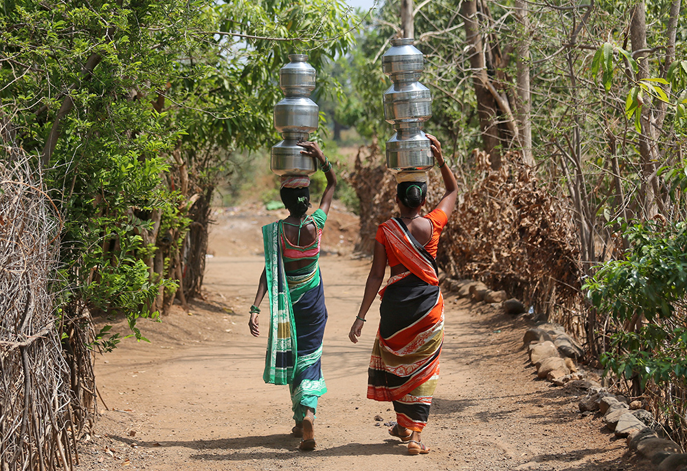 Women in Thane, India, carry water to their houses May 30, 2019. (CNS/Reuters/Francis Mascarenhas)