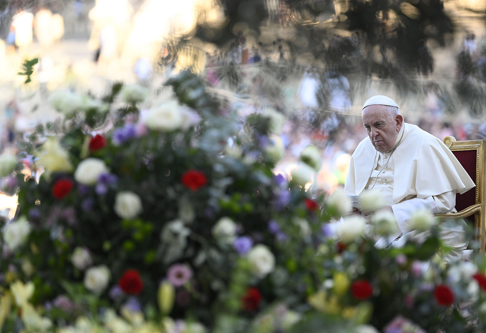 Pope Francis listens during an ecumenical prayer vigil before the assembly of the Synod of Bishops in St. Peter's Square Sept. 30 at the Vatican. (CNS/Vatican Media)