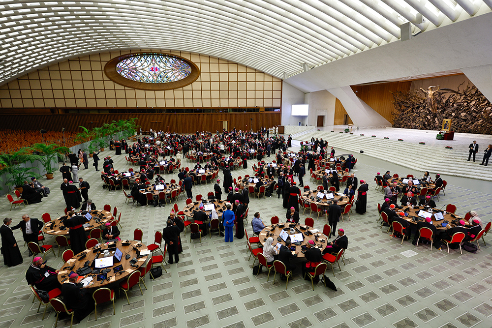 Participants in the assembly of the Synod of Bishops gather in the Paul VI Audience Hall at the Vatican before the first working session of the assembly of the Synod of Bishops Oct. 4. (CNS/Lola Gomez)