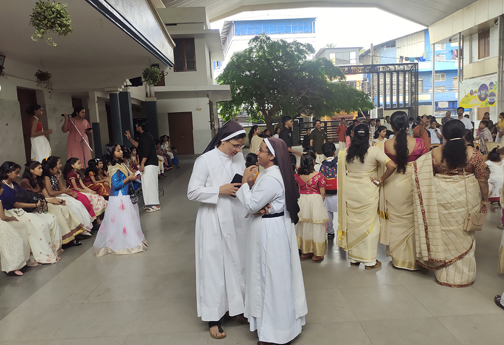 Congregation of the Mother of Carmel Srs. Graceline Jose and Sajina are pictured during a cultural celebration of the catechism in their convent under St. Mary's Basilica Cathedral parish in Kochi. (Thomas Scaria)