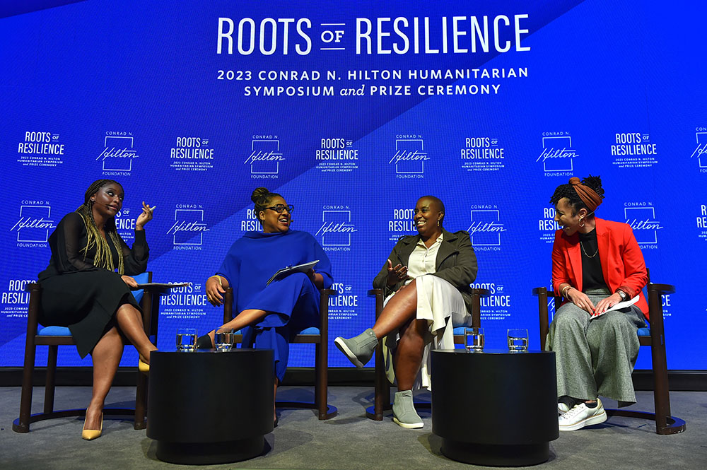 A panel at the annual Conrad N. Hilton Humanitarian Symposium Oct. 26 discusses the global impact of Black feminist movements as catalysts of change. Participants were, from left, Isha Sesay, moderator; Amoretta Morris of Borealis Philanthropy; Janis Rosheuvel of Solidaire Network; and Tynesha McHarris of the Black Feminist Fund. (AP Images for Conrad N. Hilton Foundation/Jordan Strauss)