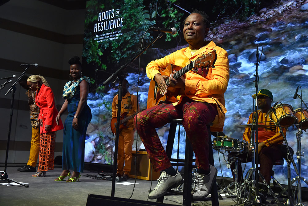 Congolese singer-songwriter Lokua Kanza and fellow musicians perform for attendees of the annual Conrad N. Hilton Humanitarian Symposium Oct. 26 at the Skirball Cultural Center in Los Angeles. (AP Images for Conrad N. Hilton Foundation/Jordan Strauss)