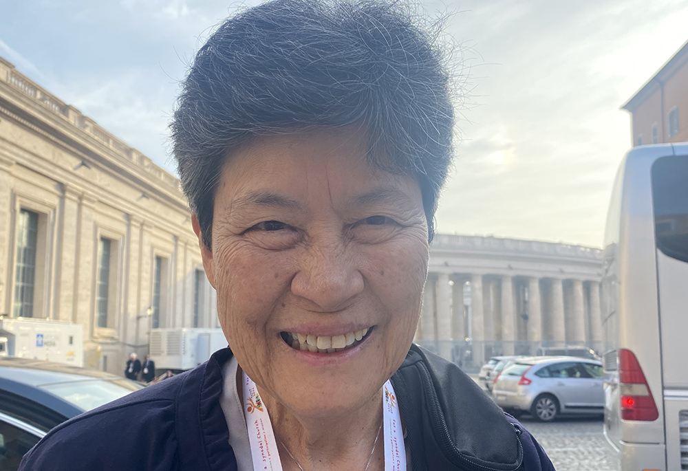 Mercy Sister Angela Perez, of Guam, poses for a photo Oct. 6 outside Paul VI Hall before the start of the third day of the Synod of Bishops in Vatican City. Seeing the pope at a roundtable, like other participants, gives her the sensation that she's witnessing the "dismantling of the hierarchical," she told Global Sisters Report. (GSR photo/Rhina Guidos)