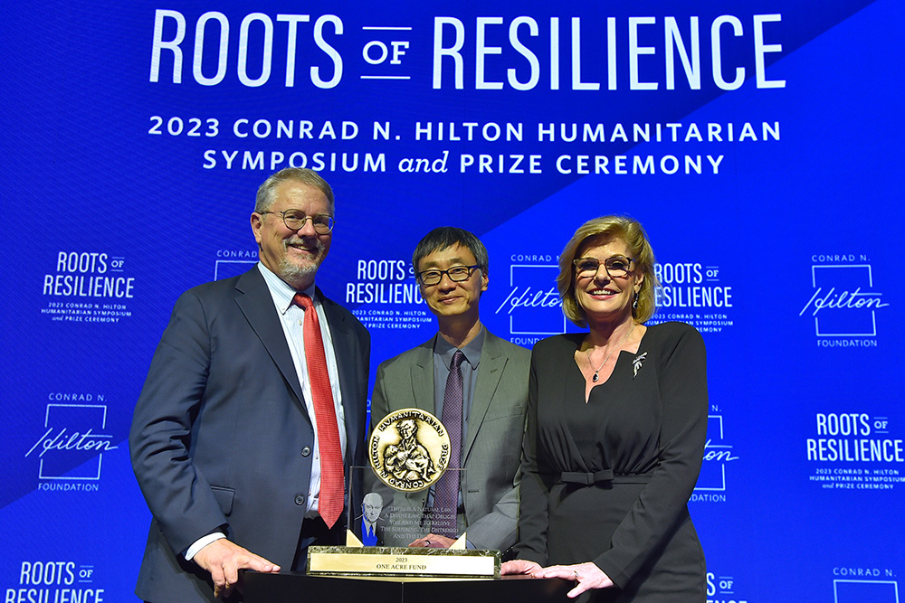 The One Acre Fund, a group supporting small-holder farmers in Africa, is the 2023 recipient of the Conrad N. Hilton Humanitarian Prize, awarded Oct. 26 in Los Angeles. From left are Peter Laugharn, president and CEO of the Conrad N. Hilton Foundation; Andrew Youn, One Acre Fund's CEO and co-founder; and Linda Hilton, vice chair of the board of the Conrad N. Hilton Foundation. (AP Images for Conrad N. Hilton Foundation/Jordan Strauss)