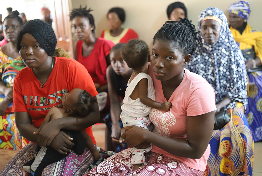 Residents of Oslo Amputee Camp in Makeni, a town in northern Sierra Leone, attend one of the religious sisters' sessions on peace, healing, and reconciliation, Sept. 19. After the end of the war in 2002, religious sisters in Sierra Leone have been carrying out sessions on forgiveness and reconciliation. (GSR photo/Doreen Ajiambo)