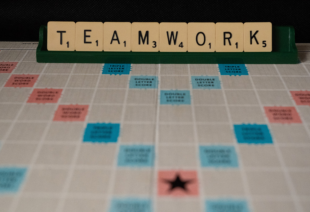 A photo illustration shows a letters board game that spells out the word "teamwork" (Unsplash/Nick Fewings)