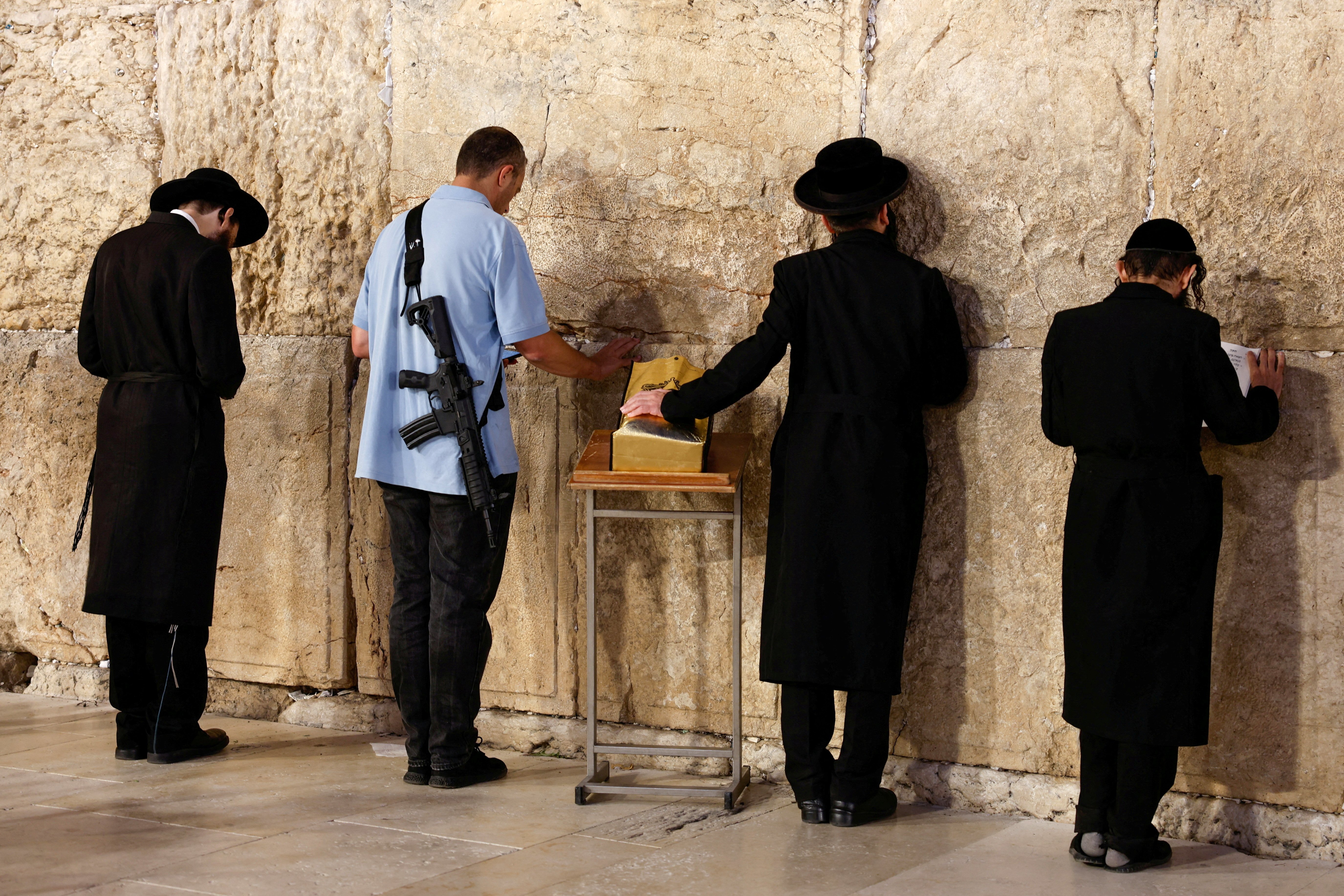 Jewish worshippers pray Nov. 6 at the Western Wall in the Old City of Jerusalem.