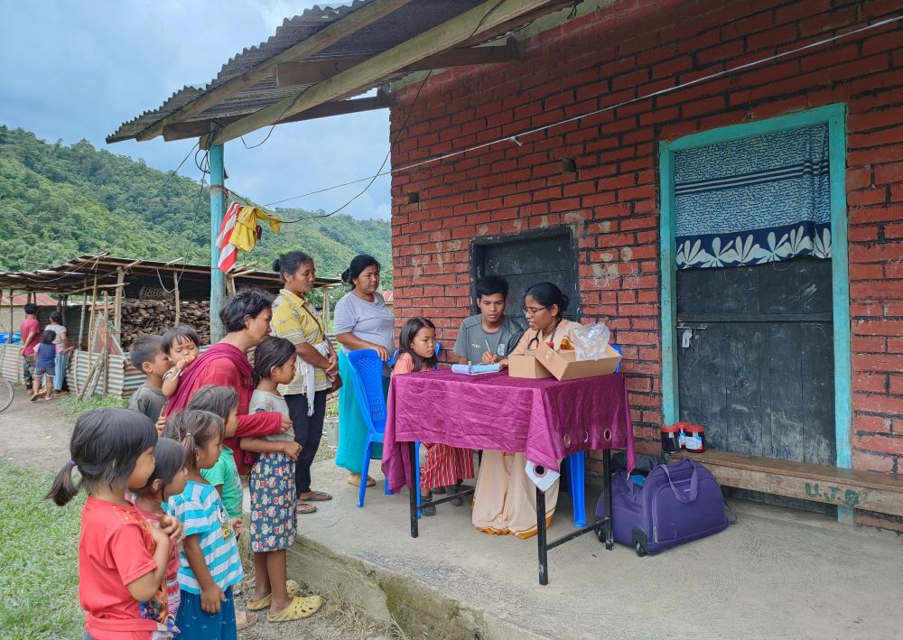 Bethany Sr. Mable Clara D'Mello attends to children in a medical camp at Denglen village in Saikul, Manipur, northeastern India (Courtesy of Mable Clara D'Mello)