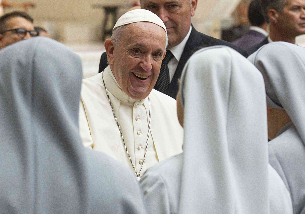 Pope Francis greets a group of nuns as he arrives for his general audience in Paul VI hall at the Vatican Aug. 21, 2019. Sister panelists for The Life discussed how the synodal process affected them, and shared their hopes for the synod. (CNS/Vatican Media)