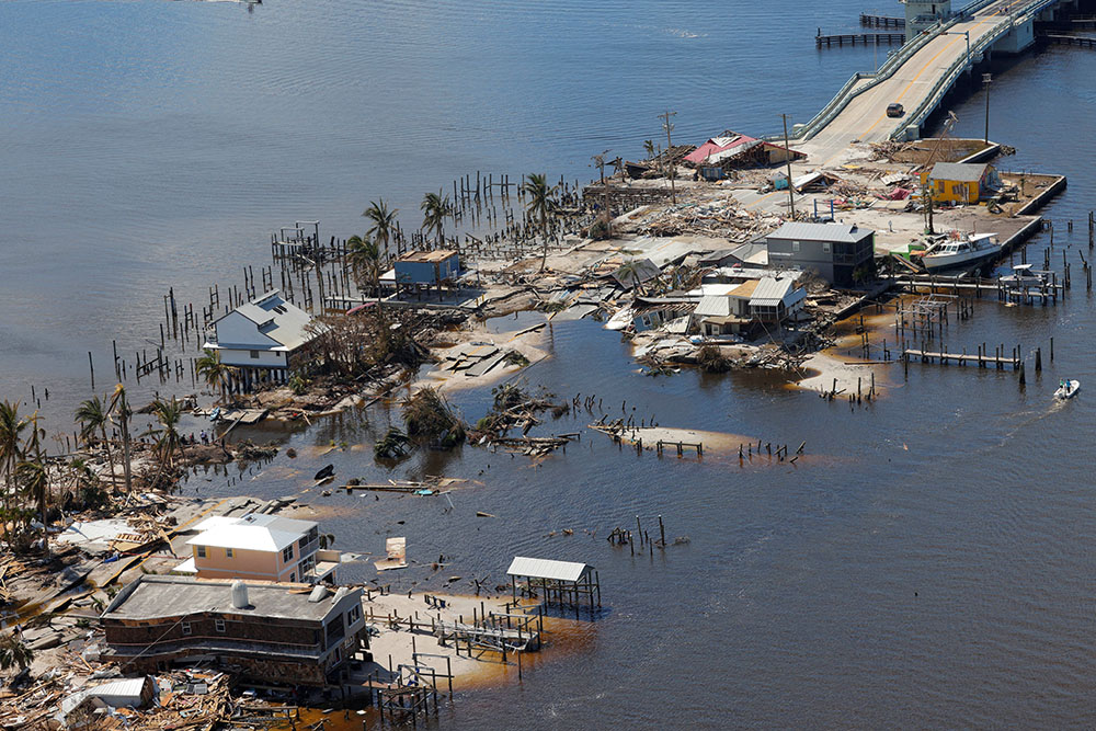 Destroyed homes and businesses on Pine Island, Florida, are seen from a U.S. Army National Guard Blackhawk helicopter Oct. 1, 2022, after Hurricane Ian caused widespread destruction. (CNS/Reuters/Kevin Fogarty)