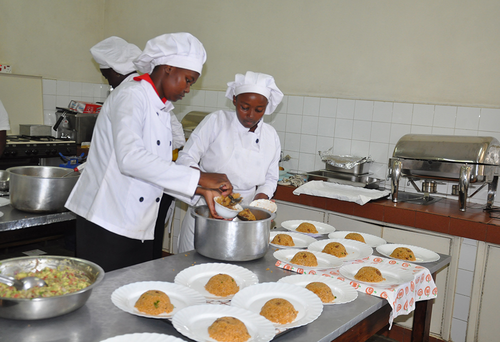Students of catering are pictured getting food ready for a service class. The catering class serves while the rest of the school acts as clients. The food and equipment are provided free to the students by the institution. (​​Lourine Oluoch)